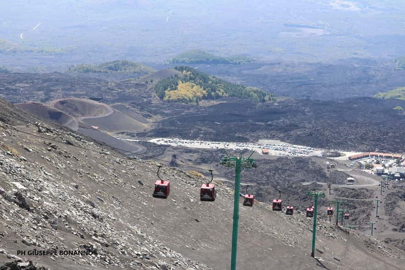 Catania, Etna trekking with guide and cable car at 3000 meters + transfer available - A break with views toward Valle del Bove