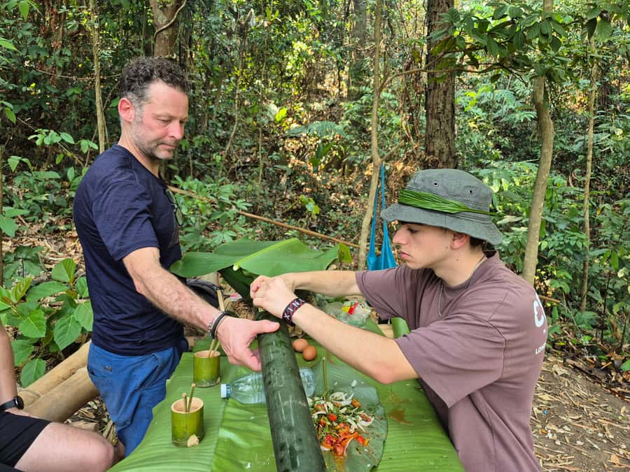 Chiang Rai Jungle Trek & Bamboo Tube Cooking Adventure - Cooling off at the waterfall