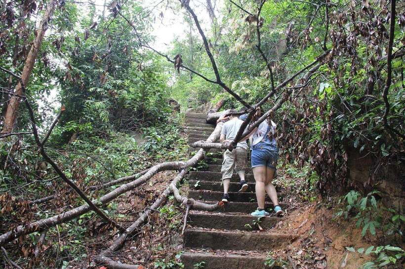 From Siem Reap: Phnom Kulen National Park Trekking Tour - Cooling off at the waterfall