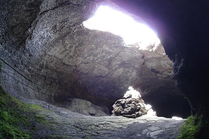 One Day Tour in Catania and Trekking on Etna - Entering a volcanic cave with helmets and torches