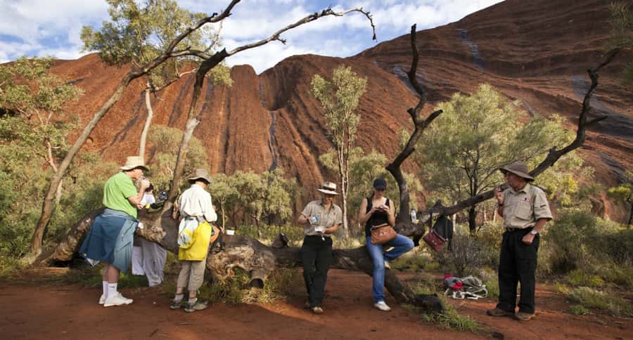 Uluru: Guided Trek of Uluru's Base in a Small Group - Sunrise gives Uluru its first great moment