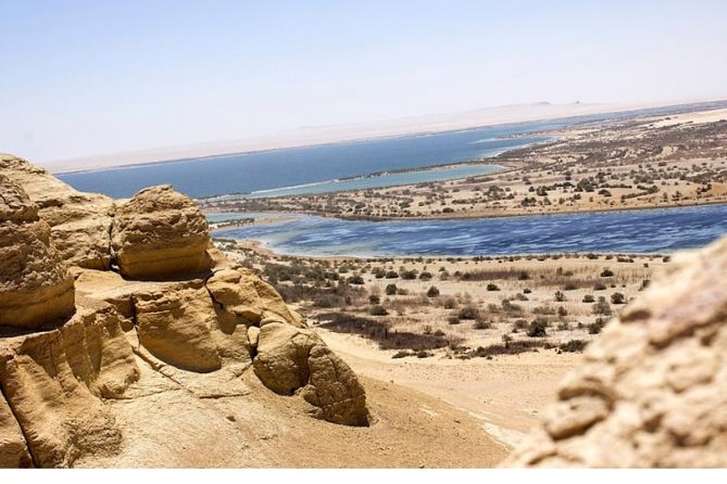 Valley of whale's & Al Fayoum by jeep 4<em>4 – private Desert full Day Trek – Cairo – The Best Parts of This Fayoum Day’ /></p>
<ul>
<li><strong>Whale Valley fossils:</strong> Walk marked desert paths among complete fossilized whale skeletons and learn how these animals changed from land mammals into ocean-going creatures.</li>
<li><strong>Wadi El Rayan waterfalls:</strong> See Egypt’s unusual desert waterfalls, created where water flows between the lakes of the protected area.</li>
<li><strong>A proper 4×4 desert section:</strong> The Range Rover is intended for the sandy and uneven route toward Whale Valley and Mudawara Mountain.</li>
<li><strong>Tunis Village crafts:</strong> Pause in a simple village setting to see handmade items and have lunch or a drink.</li>
<li><strong>Private sightseeing:</strong> Your group does not share the vehicle or schedule with strangers.</li>
<li><strong>A useful natural-science museum:</strong> Whale Valley has a small museum, a cafe, restrooms, and marked trails, making the remote stop easier to manage.</li>
</ul>
<h2>Leaving Cairo for the Fayoum Basin</h2>
<p><img width="669" height="446" decoding="async" src=